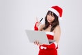 Beautiful portrait young asian woman in Santa holding credit card and laptop computer for shopping online in Christmas Royalty Free Stock Photo