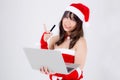 Beautiful portrait young asian woman in Santa holding credit card and laptop computer for shopping online in Christmas Royalty Free Stock Photo