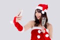 Beautiful portrait young asian woman in Santa holding glass of champagne and selfie with phone in party celebrating. Royalty Free Stock Photo