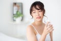 Beautiful portrait young asian woman smile and drinking water glass with fresh and pure for diet Royalty Free Stock Photo