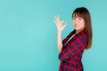 Beautiful portrait young asian woman smiling confident and excited summer holiday isolated blue background Royalty Free Stock Photo