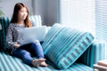 Beautiful of portrait young asian woman using laptop for leisure on sofa in living room, girl working online with notebook Royalty Free Stock Photo