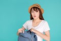 Beautiful portrait young asian woman wear hat open backpack and surprise travel summer trip holiday in vacation isolated