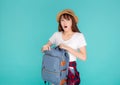 Beautiful portrait young asian woman wear hat open backpack and surprise travel summer trip holiday in vacation isolated.