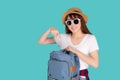 Beautiful portrait young asian woman wear sunglasses and hat smiling pointing and open backpack travel summer trip.