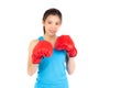 Beautiful portrait young asian woman wearing red boxing gloves with strength and strength isolated on white background Royalty Free Stock Photo