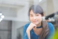 Beautiful portrait young asian woman writer smiling thinking idea and writing on notebook or diary with happy Royalty Free Stock Photo