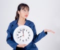 Beautiful portrait young business asian woman smiling holding clock isolated on white background Royalty Free Stock Photo