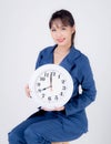Beautiful portrait young business asian woman smiling holding clock isolated on white background Royalty Free Stock Photo