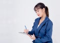 Beautiful portrait young business asian woman thinking and writing on clipboard for success  on white background Royalty Free Stock Photo