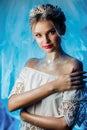 Beautiful portrait of a young girl. The image of a snow queen with a crown on his head