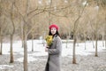 beautiful portrait of a young woman with mimosa flowers outdoors. Royalty Free Stock Photo