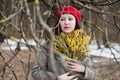 beautiful portrait of a young woman with mimosa flowers outdoors. Royalty Free Stock Photo