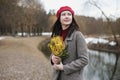 beautiful portrait of a young woman with mimosa flowers outdoors. Royalty Free Stock Photo