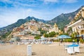 Beautiful Positano with hotels on hills leading down to coast, comfortable beaches and azure sea on Amalfi Coast in Campania,