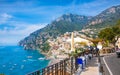 Beautiful Positano with hotels on hills leading down to coast, comfortable beaches and azure sea on Amalfi Coast in Campania,