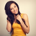 Beautiful positive happy laughing woman in yellow shirt with too