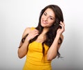 Beautiful positive happy woman in yellow shirt and long hair too