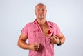 Beautiful positive man with a heart on his chest, to Valentine`s day Royalty Free Stock Photo