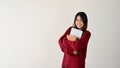 A beautiful Asian female college student carrying her laptop and school books Royalty Free Stock Photo