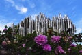 Beautiful postcard monument with a bright blue sky on background. abstract silver tubes with reflections