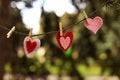 Beautiful postcard with red and pink hearts hanging Royalty Free Stock Photo