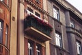 Beautiful Prague balcony filled with flowers on a classic eastern european facade