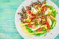 Beautiful prawn salad with cucumber, tomatoes, lettuce, avocado and canned octopus