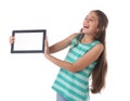 Beautiful pre-teen girl laughing with a tablet Royalty Free Stock Photo