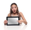 Beautiful pre-teen girl showing a tablet computer.