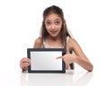 Beautiful pre-teen girl showing a tablet computer. Royalty Free Stock Photo