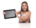 Beautiful pre-teen girl with a tablet computer. Royalty Free Stock Photo