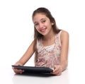 Beautiful pre-teen girl with a tablet computer. Royalty Free Stock Photo