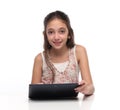 Beautiful pre-teen girl with a tablet computer. Royalty Free Stock Photo
