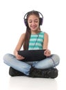 Beautiful pre-teen girl using a tablet computer Royalty Free Stock Photo