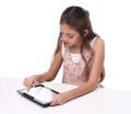 Beautiful pre-teen girl using a tablet computer. Royalty Free Stock Photo