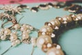 Beautiful precious shiny jewelery trendy glamorous jewelry set, necklace, earrings, rings, chains, brooches with pearls Royalty Free Stock Photo