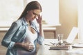 Beautiful Pregnant Business Woman Have Headache. Royalty Free Stock Photo