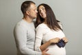 Beautiful pregnant couple hugging and smiling. Love and tenderness. The happiness of waiting Royalty Free Stock Photo