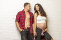 Beautiful pregnant couple hugging and smiling. Love and tenderness. The happiness of waiting Royalty Free Stock Photo