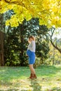 Beautiful Pregnant female in autumn Royalty Free Stock Photo