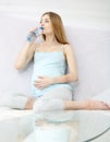 Beautiful pregnant girl drinks water Royalty Free Stock Photo