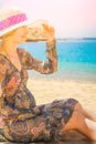 Beautiful pregnant girl in hat at sea background Royalty Free Stock Photo
