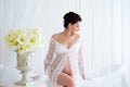 Beautiful pregnant in light white lace negligee in the bathroom Royalty Free Stock Photo