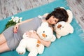 Beautiful pregnant mother with teddy bears. Motherhood Royalty Free Stock Photo