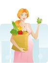 Beautiful pregnant woman with apple