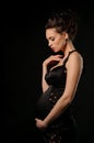 Beautiful pregnant woman in black dress Royalty Free Stock Photo