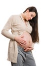 Beautiful pregnant woman checking her tummy Royalty Free Stock Photo