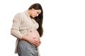 Beautiful pregnant woman checking her tummy on white background Royalty Free Stock Photo