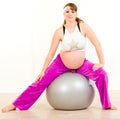 Beautiful pregnant woman doing exercises on ball Royalty Free Stock Photo